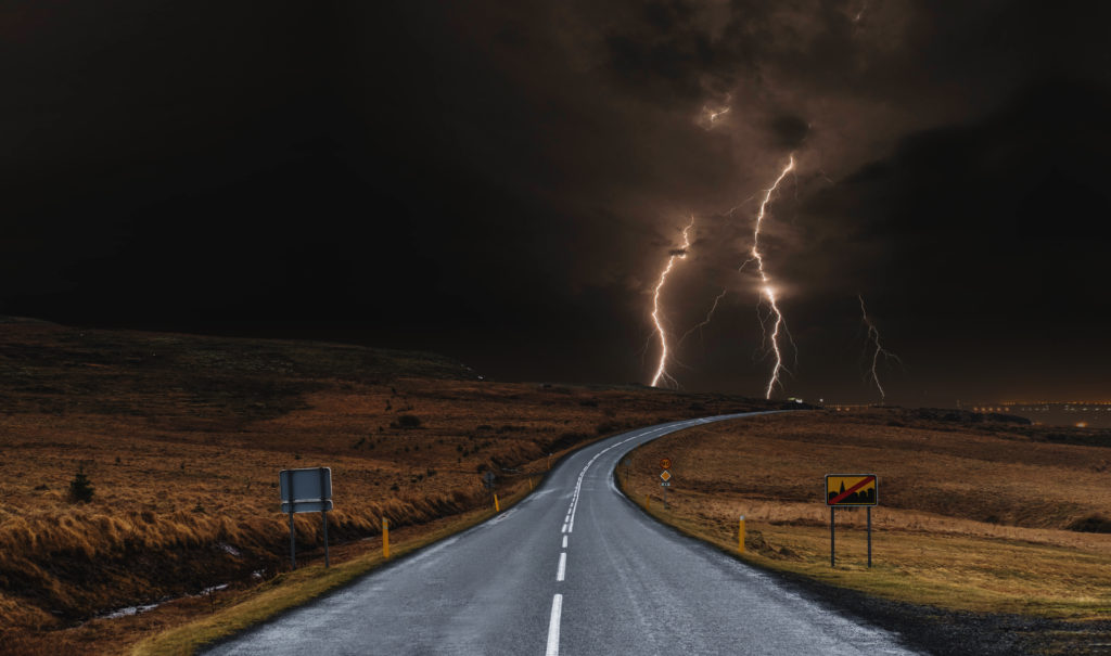 The road with powerful thunderstorm landscaped